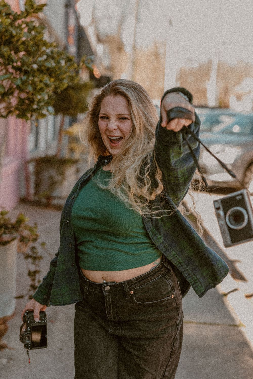 A series of candid lifestyle photos showing joyful moments in green clothing and denim on an urban street.