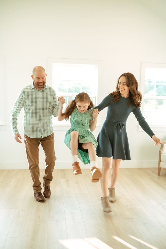 Playful movement and dance captured in a series of candid moments in a bright indoor space.