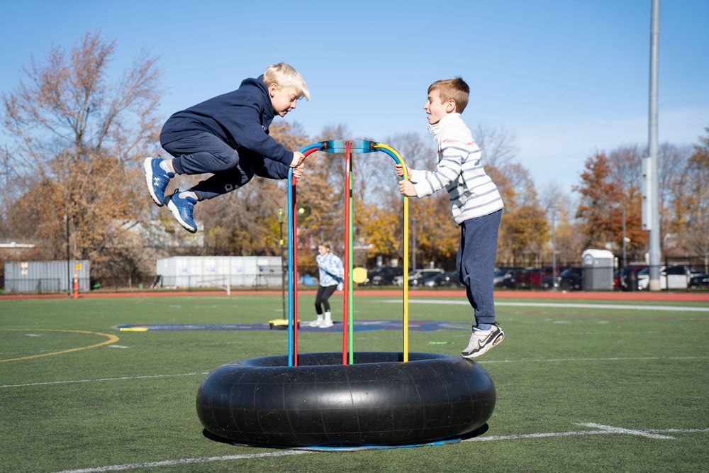 kids play in the football field at Belmont’s Skip Viglirolo Ice skating Rink Grand Opening - Leah Ramuglia Event Photography