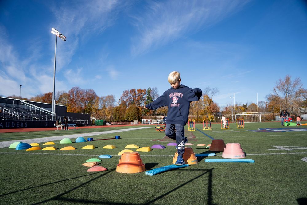 Kids have fun on the obstacle course at Belmont’s Skip Viglirolo Ice skating Rink Grand Opening - Leah Ramuglia Event Photography