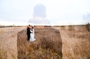 Panoramic sequence of couple walking through tall dry grass in an open field.