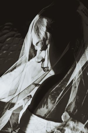 Artistic black and white veil photos showing flowing fabric movement in dramatic lighting.