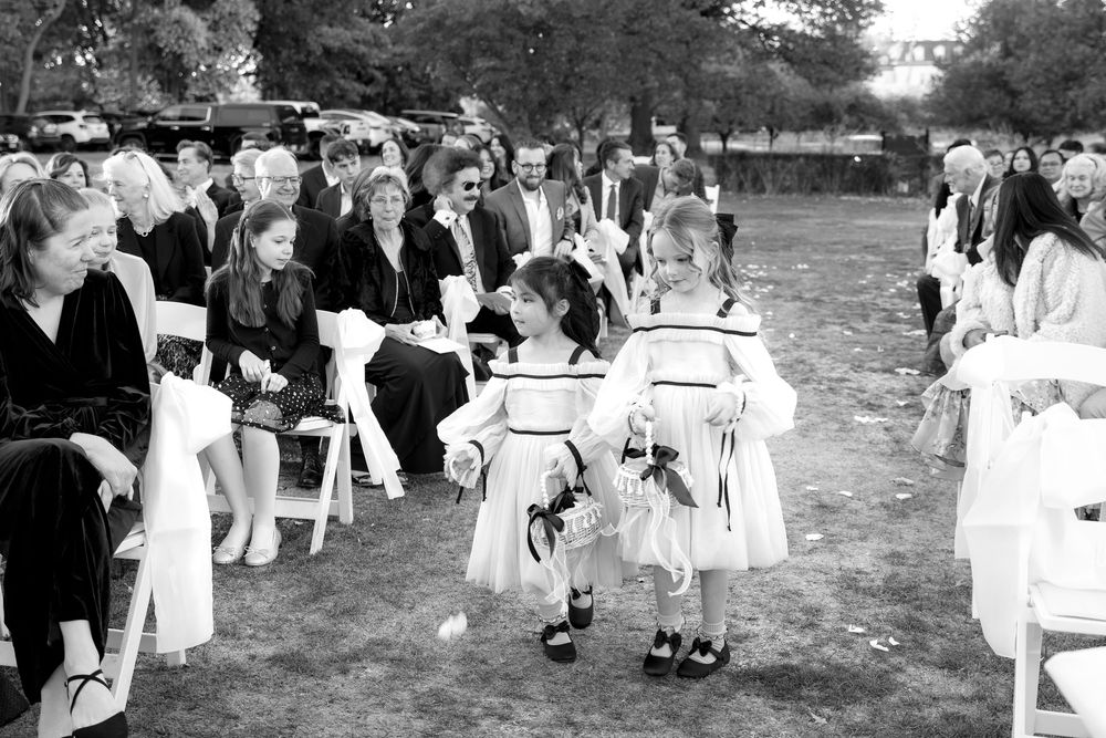 A black and white photo sequence showing people in formal attire walking through an outdoor event space.