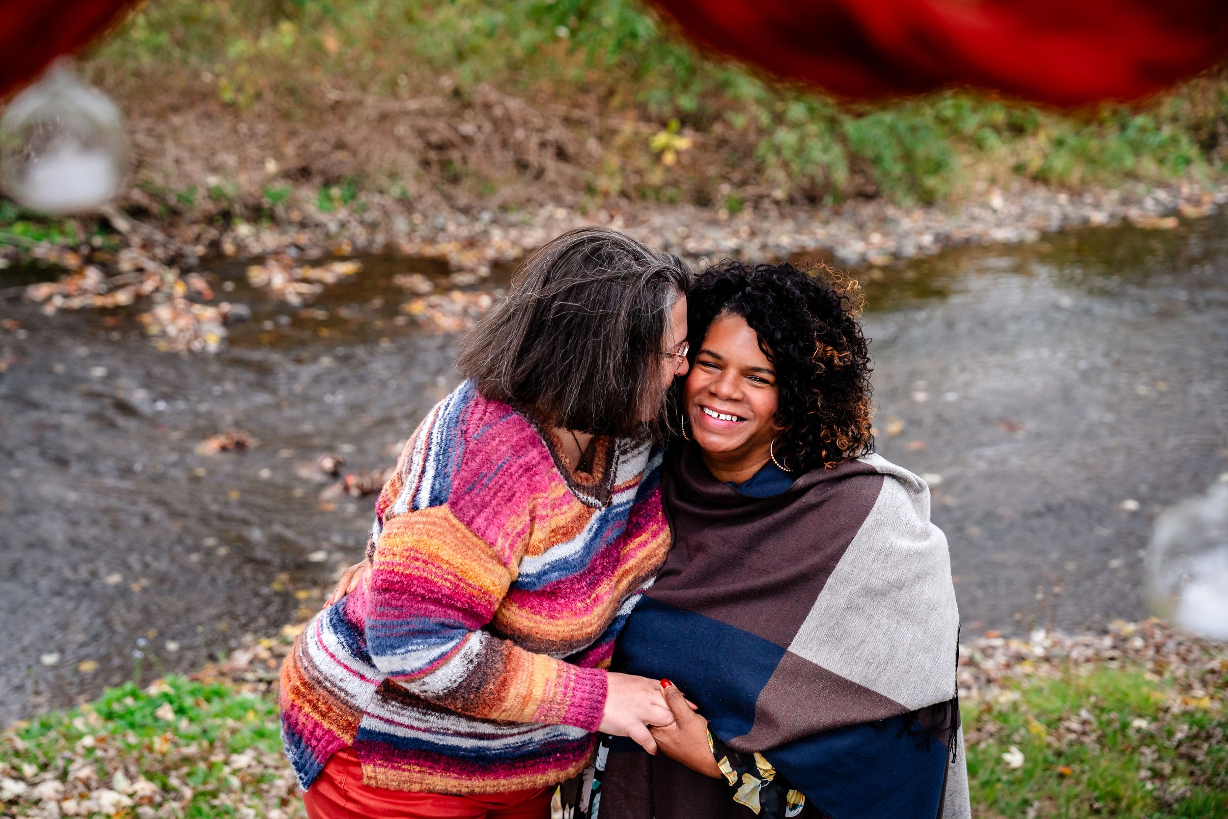A series of candid photos showing two people embracing and sharing joyful moments outdoors.
