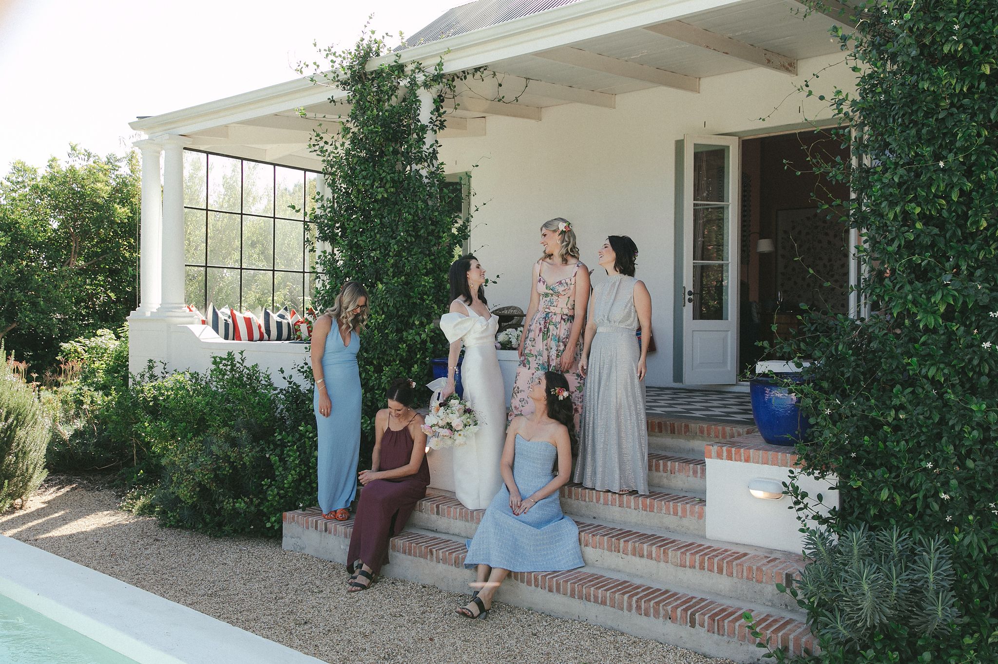 Bride sharing a moment with bridesmaids before the ceremony at La Cotte
