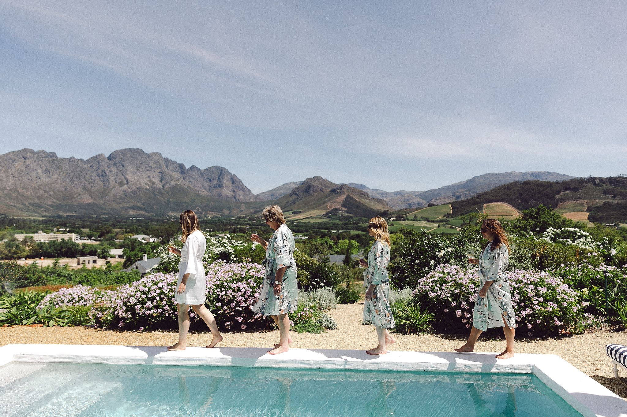Bride sharing a moment with bridesmaids before the ceremony at La Cotte