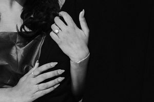 Artistic black and white photo montage shows multiple close-up shots of expressive hands against dark backgrounds.