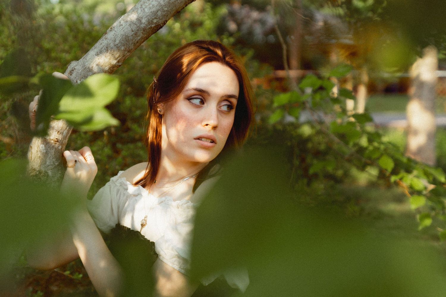 Woman looking off into the distance in fantasy inspired creative mini photo session in Bowling green Kentucky