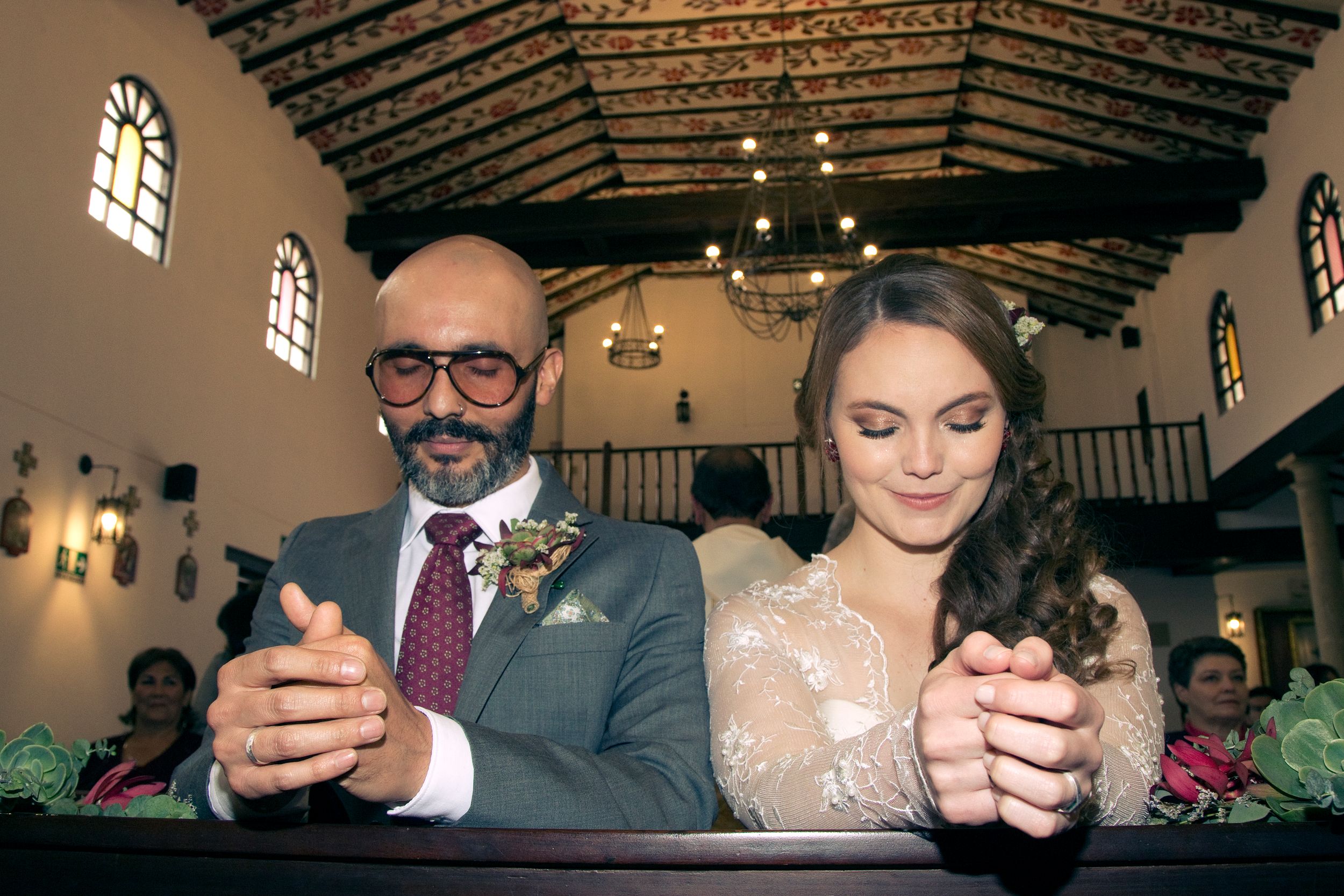 A couple gets married in a Catholic church.