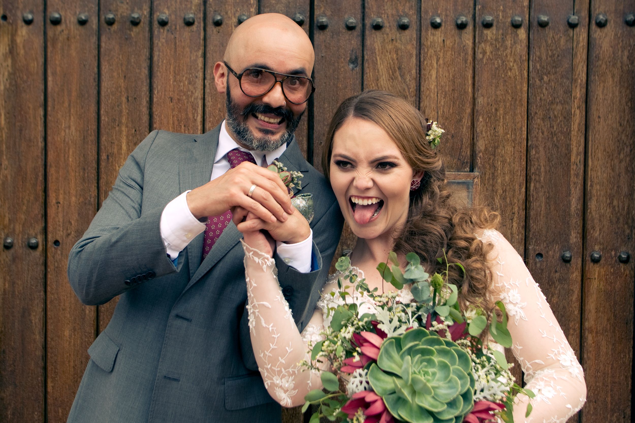 Newlywed couple posing for a photo.