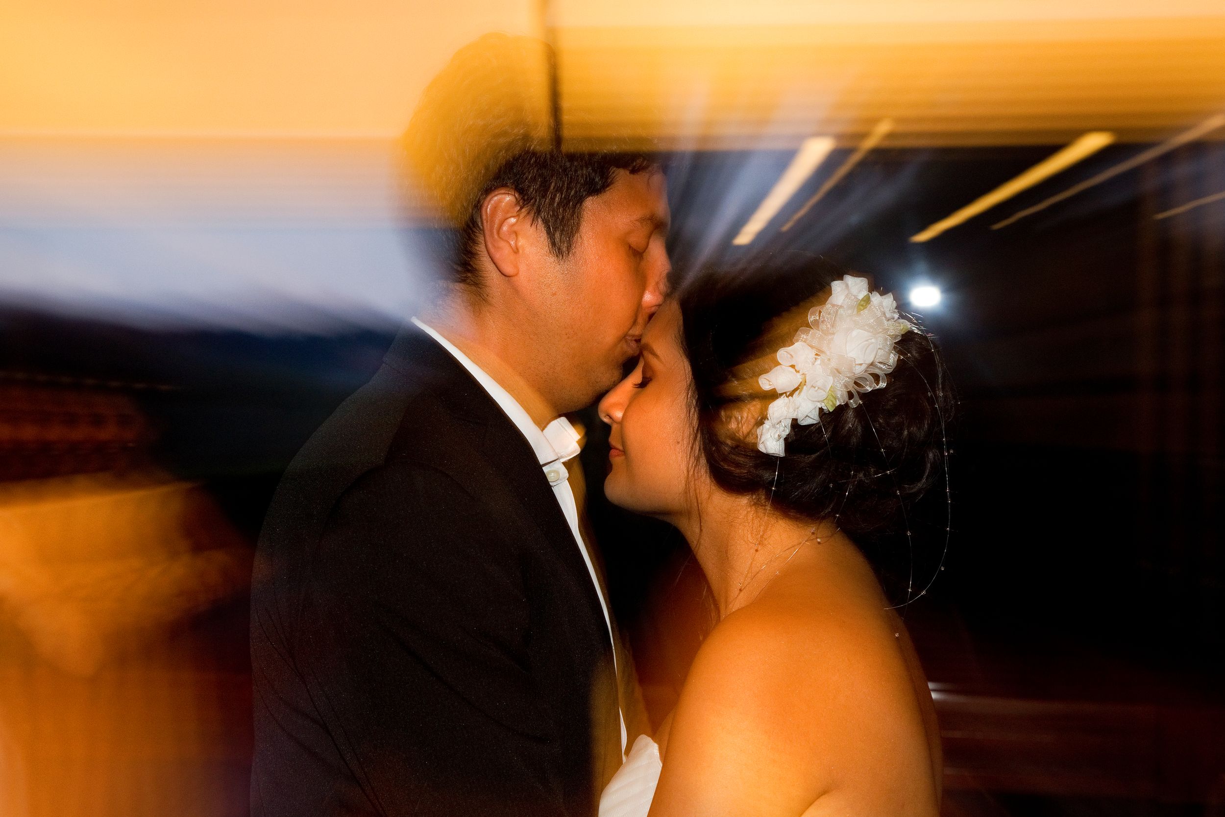 Zoom shot of a couple during their wedding.
