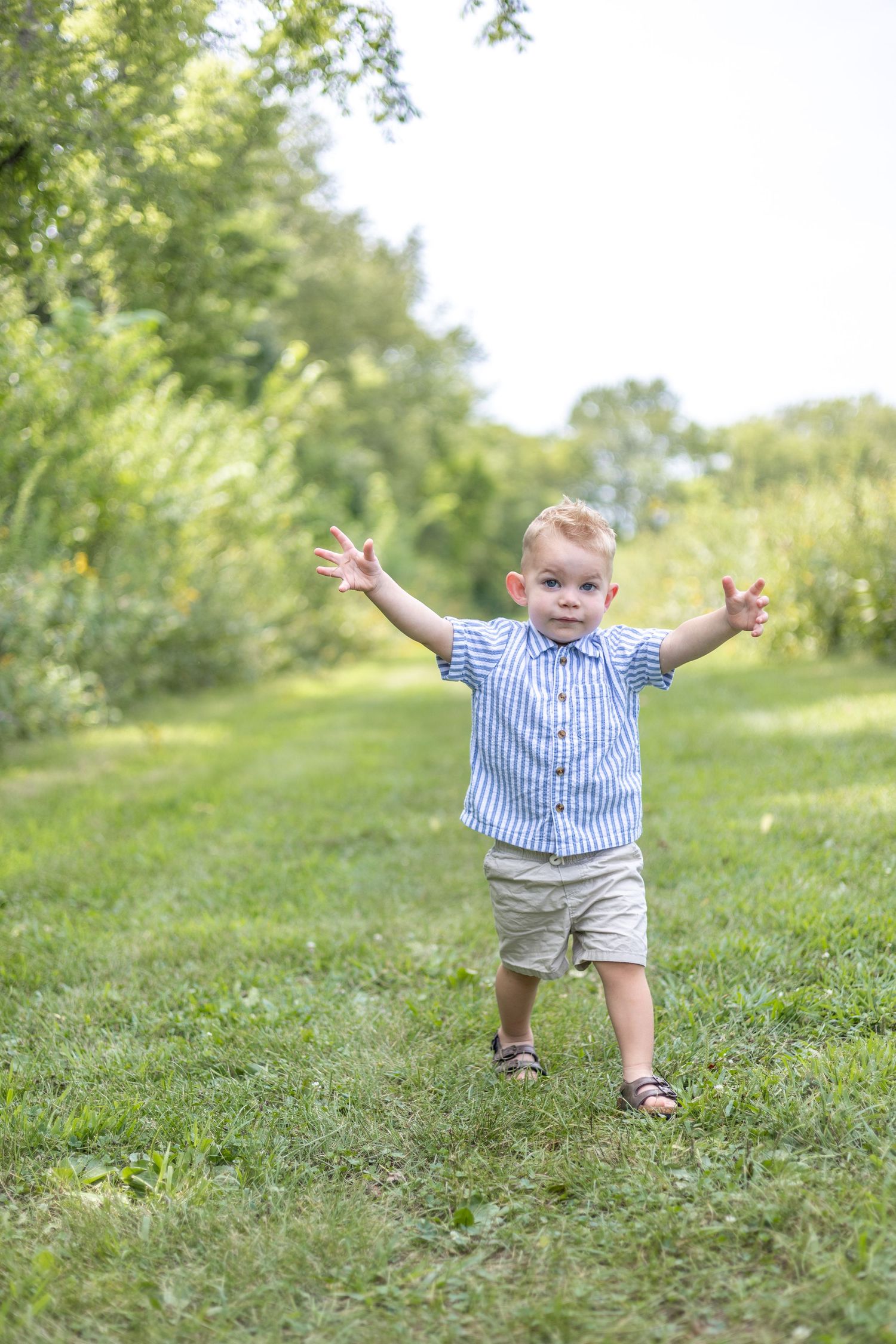 Springfield, IL Photographer captures a boy showing his goofy side during a milestone session in Central, IL