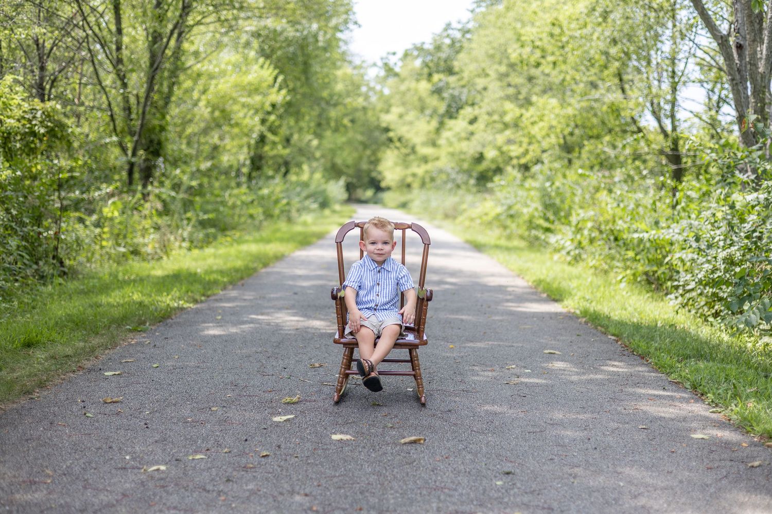 Springfield, IL Photographer captures a boy smiling on a trail during a milestone session in Central, IL