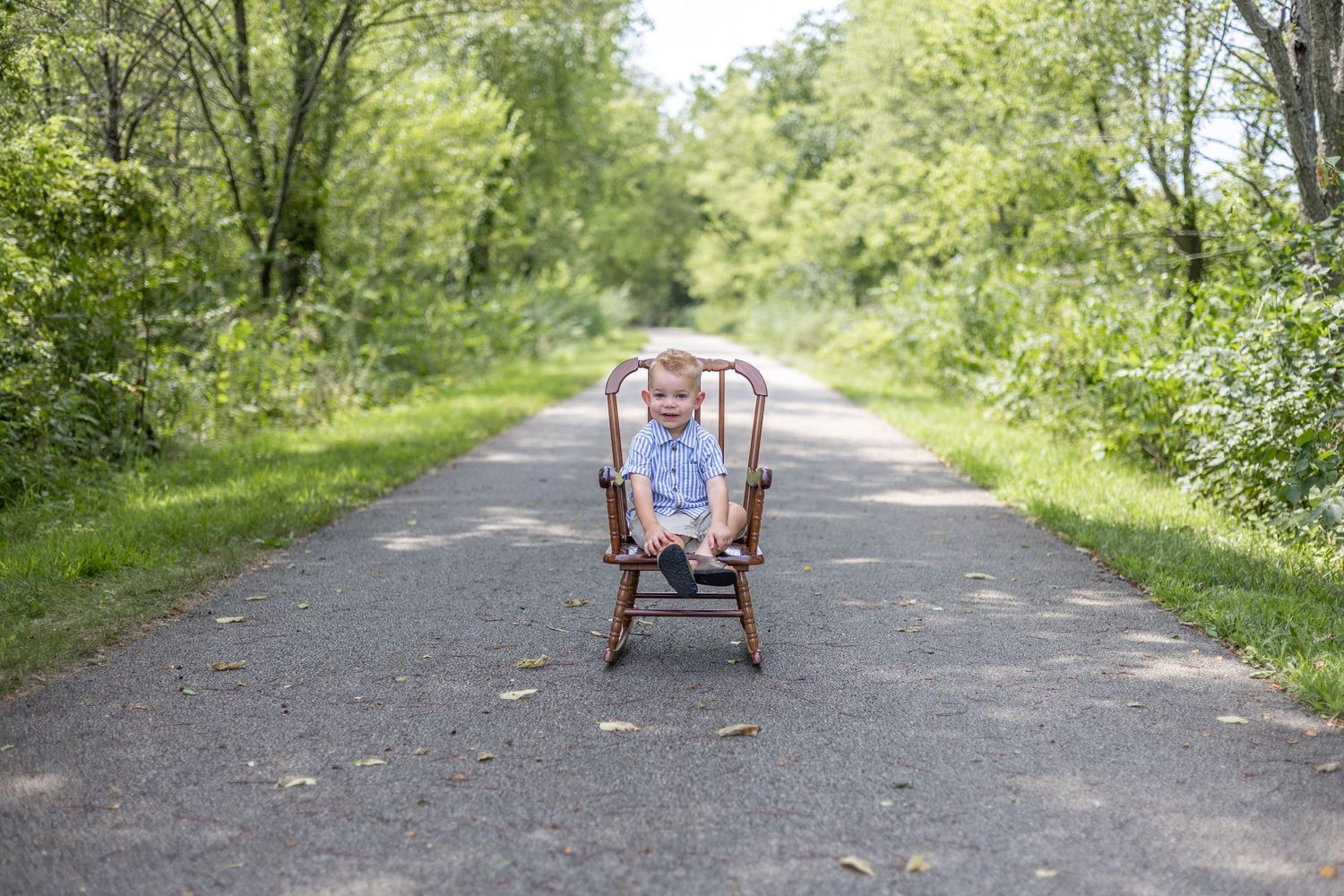 Springfield, IL Photographer captures a boy smiling on a trail during a milestone session in Central, IL