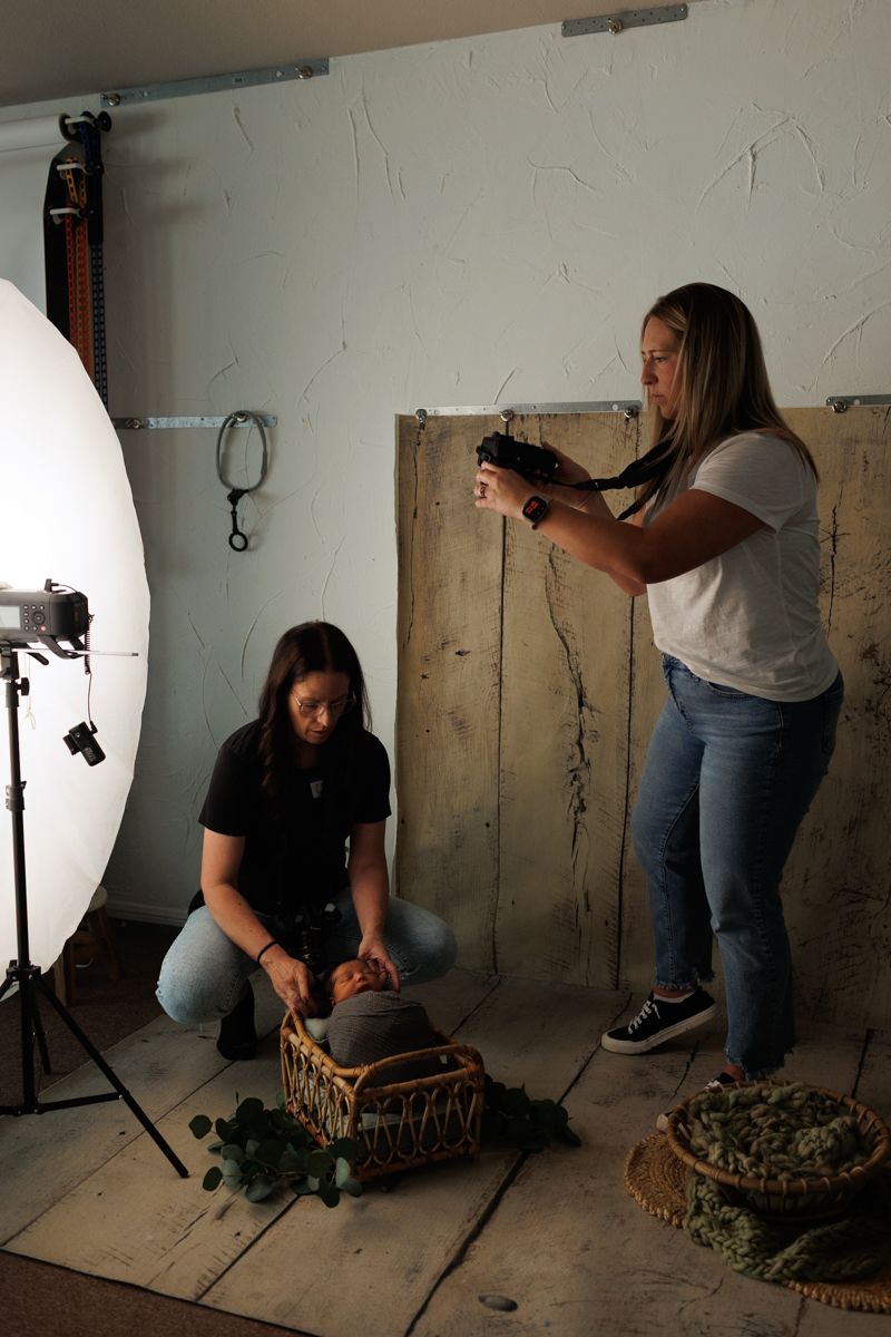 Behind the scenes photo studio setup showing lighting equipment and props.
