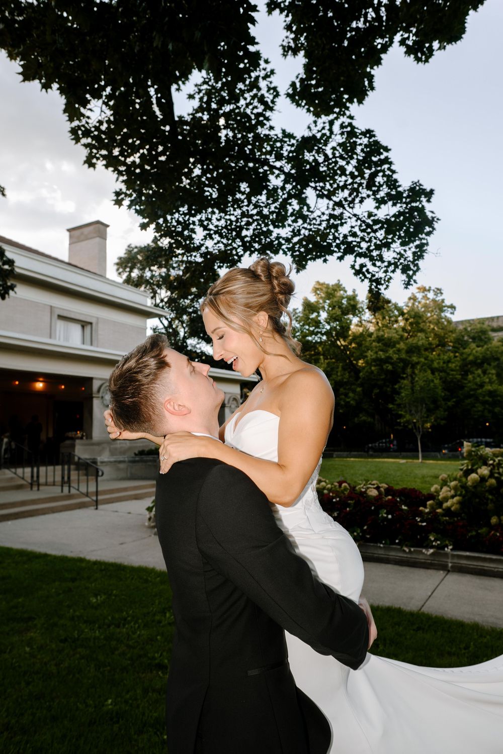 A romantic moment captured in a series of wedding photos showing a couple in black and white attire embracing on their special day.