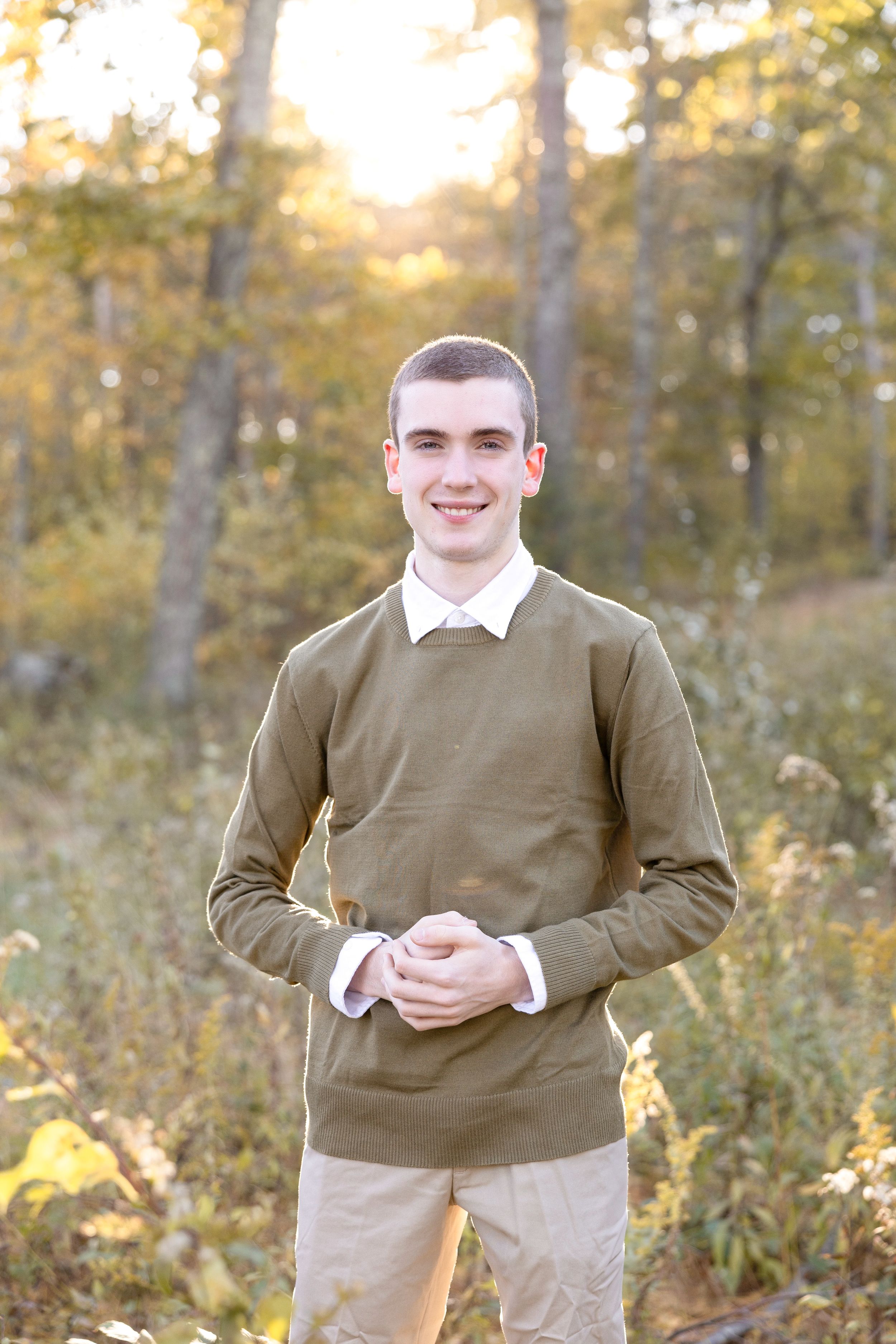 Outdoor autumn portrait session showing casual poses against golden foliage background.