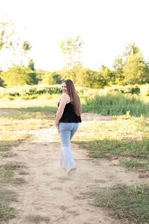 Artistic outdoor photo sequence showing movement and dance poses against a golden sunset backdrop.
