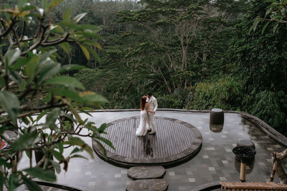 Panoramic view of a tropical wedding venue with mountains in the background.