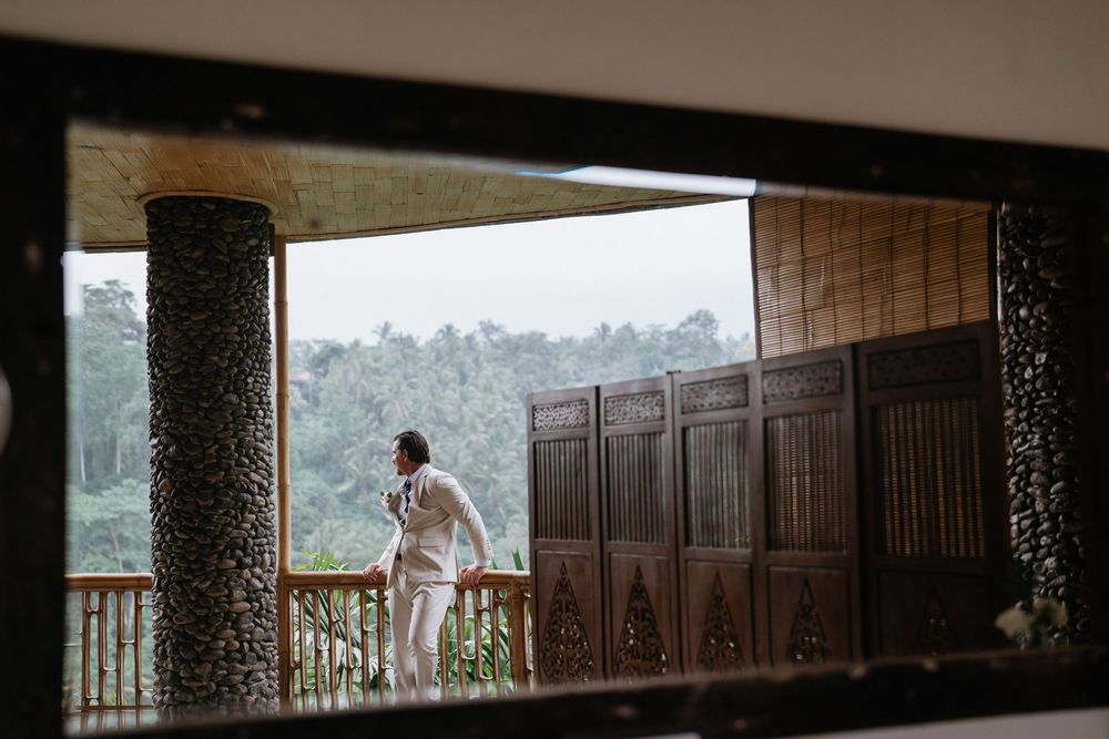 Interior view of a modern wedding venue with large windows and mountain views.