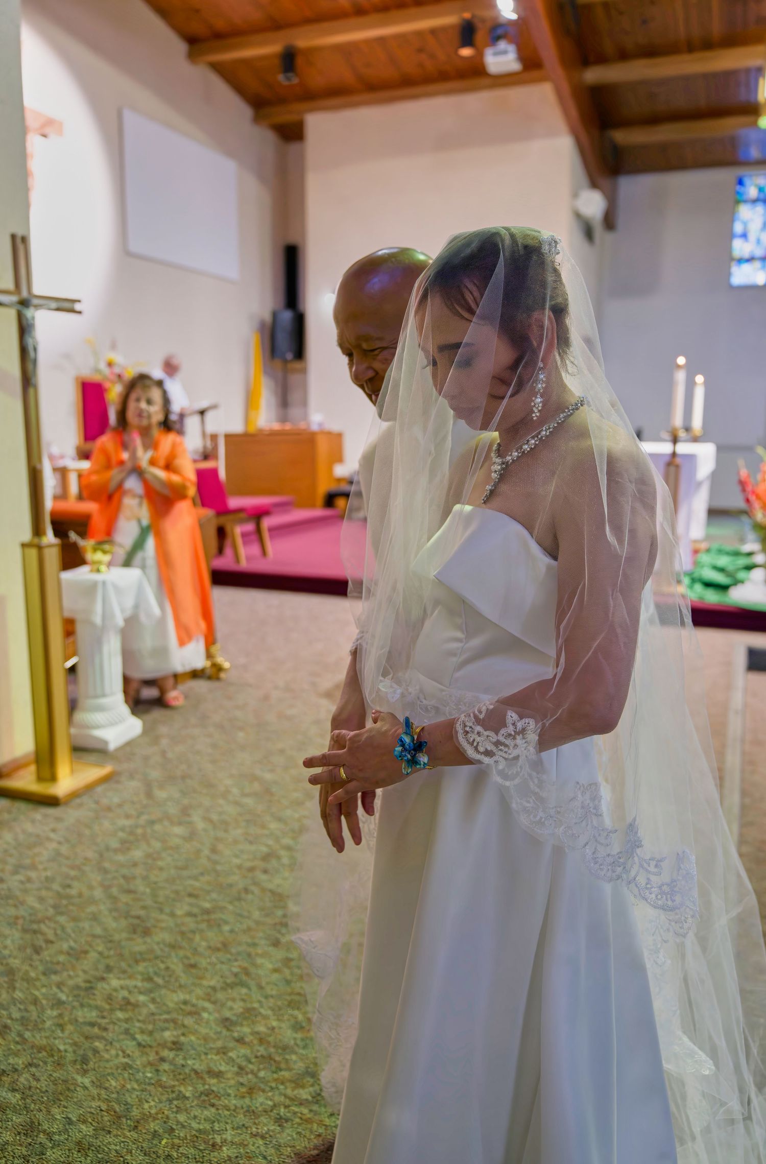 A sequence of wedding photos showing the bride and groom sharing intimate dance moments in a carpeted venue.