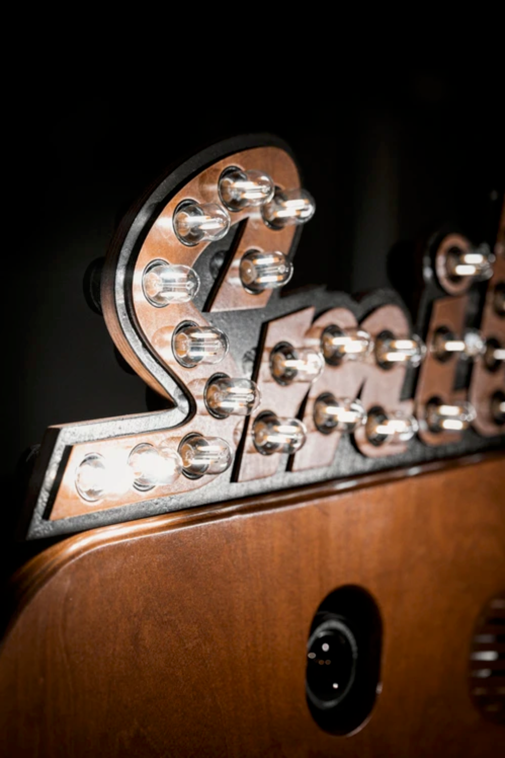 Close-up macro shots of guitar tuning pegs and headstock in varying angles showing chrome hardware against brown wood.