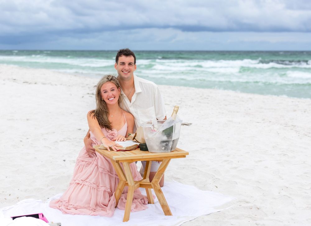 A group of beach photos showing someone in a pink dress posing on white sand with turquoise ocean waves in the background.