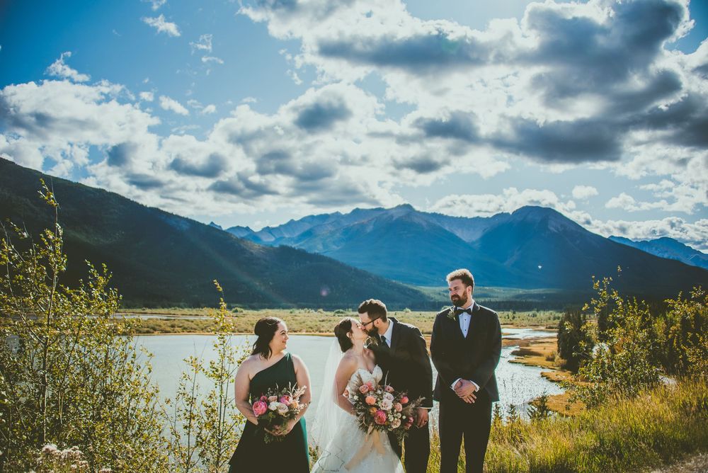 Wedding celebration overlooking a scenic mountain lake with dramatic clouds rolling across the sky Banff Micro Wedding Photographer