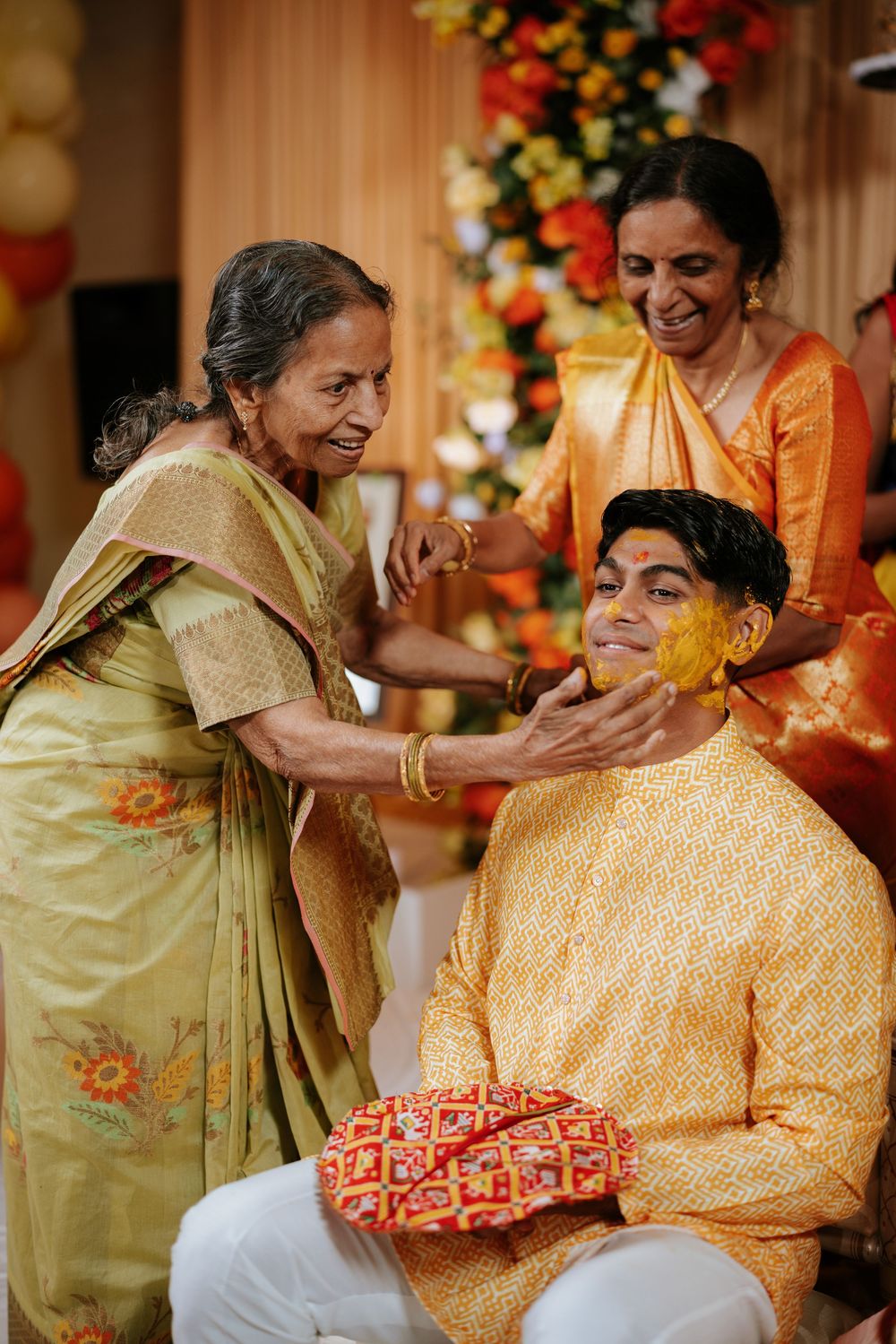A sequence of candid moments captured during a traditional Indian wedding ceremony with vibrant orange and yellow attire.