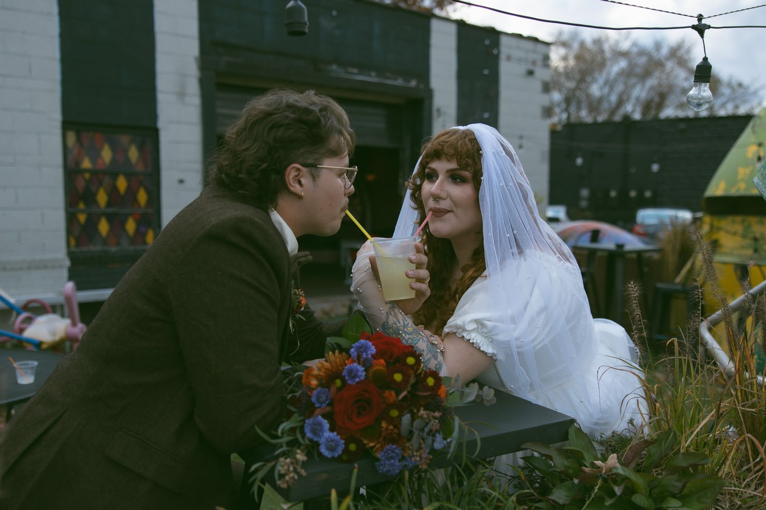 newly wed couple alternative vintage chapel asheville fleetwoods drinks cheers elopement fun