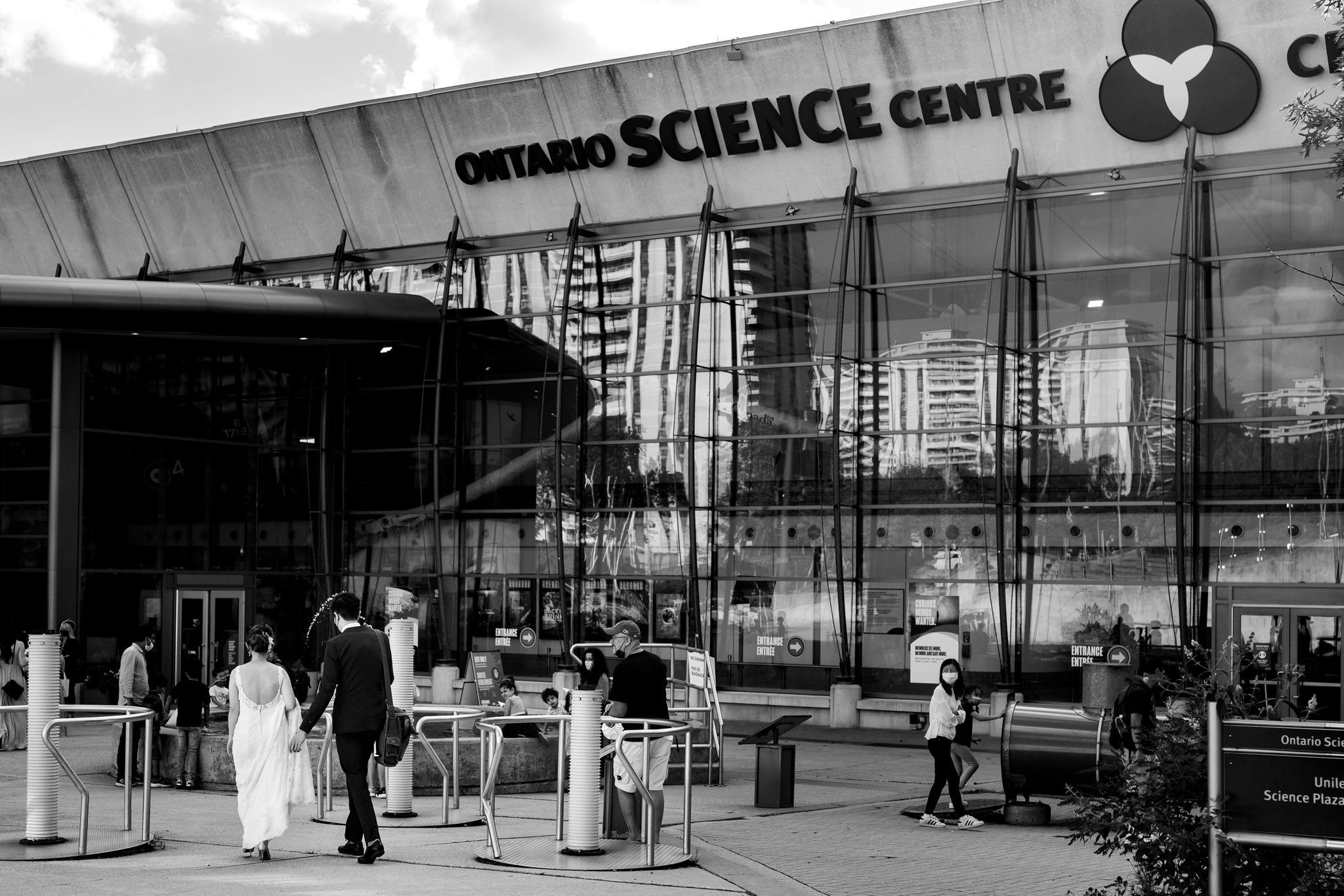 Exterior view of the Ontario Science Centre entrance with modern architecture and signage.