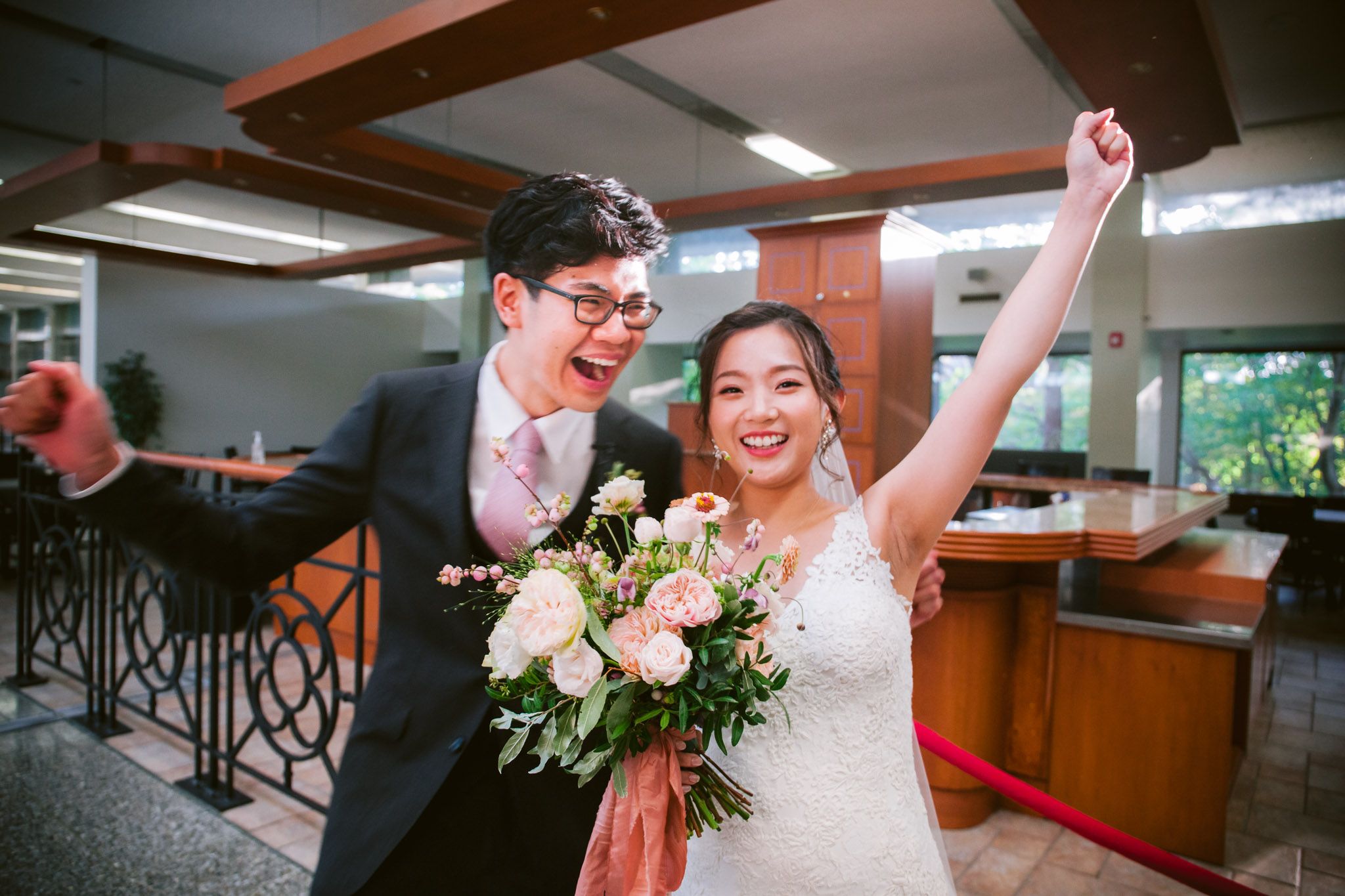 A joyful wedding celebration captured in a series of candid moments showing dancing and laughter at an indoor venue.