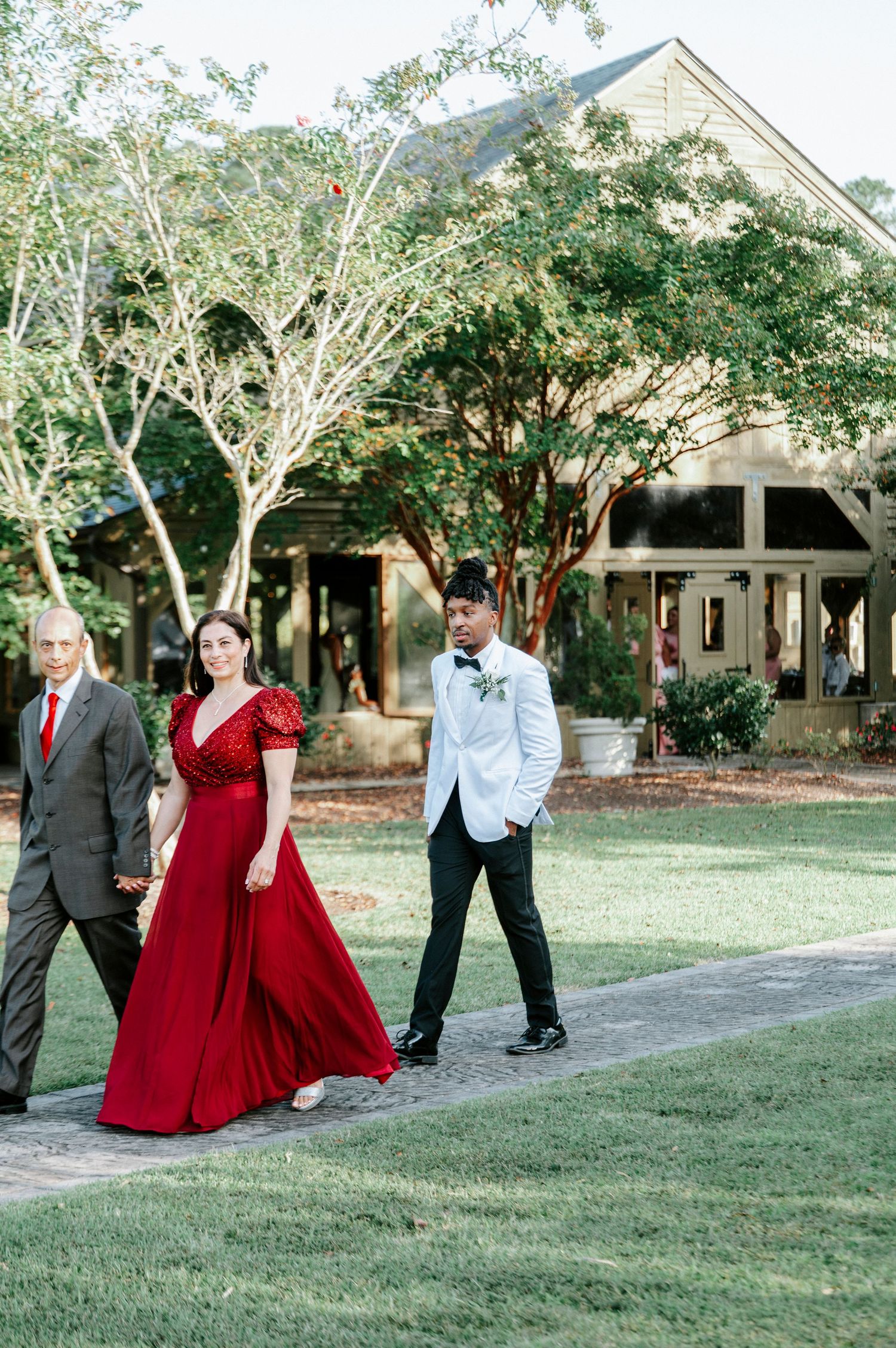 A sequence of wedding party photos showing playful interactions between people in formal attire on a grassy lawn.
