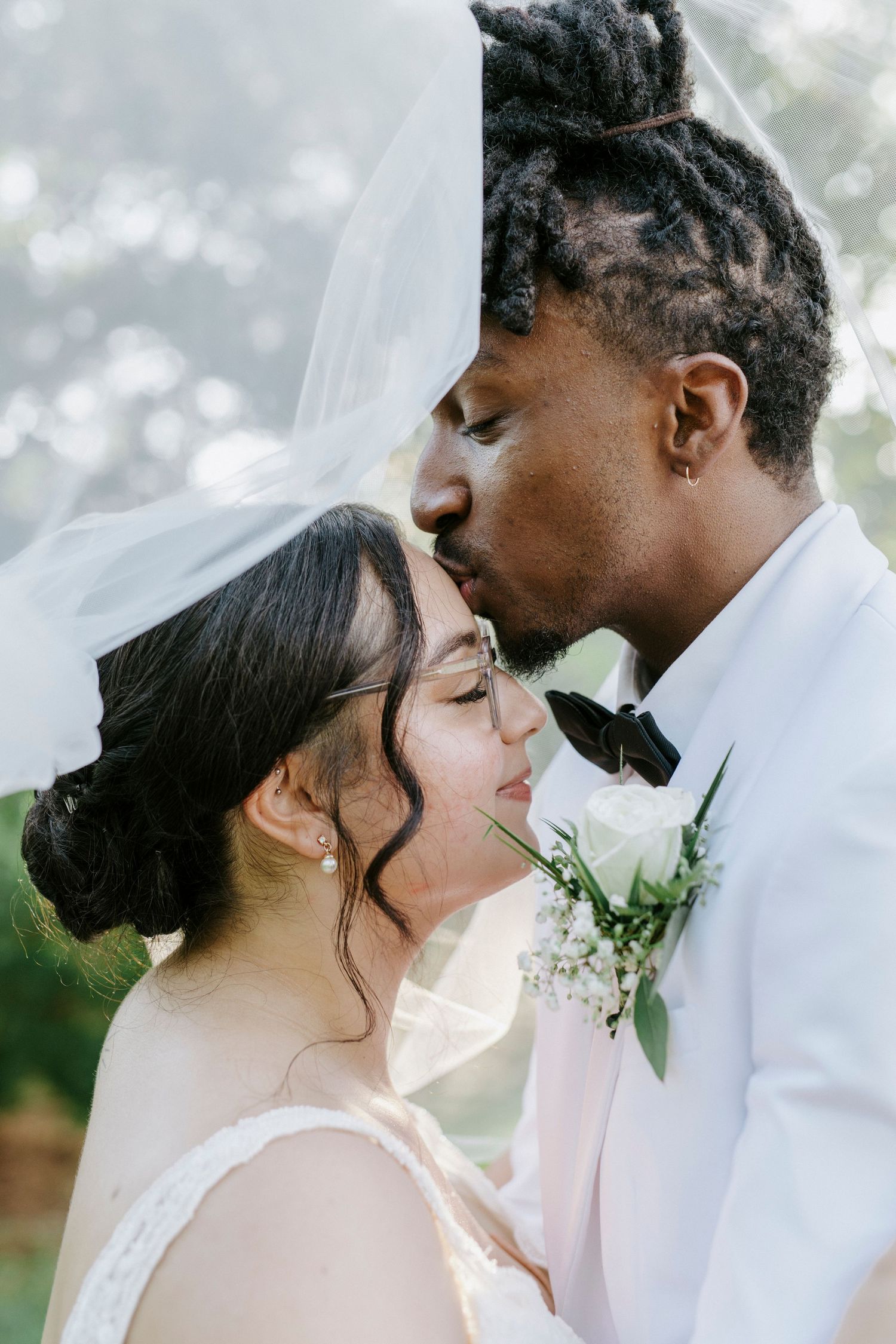 Close-up wedding portraits capturing intimate moments between newlyweds against a soft bokeh background.
