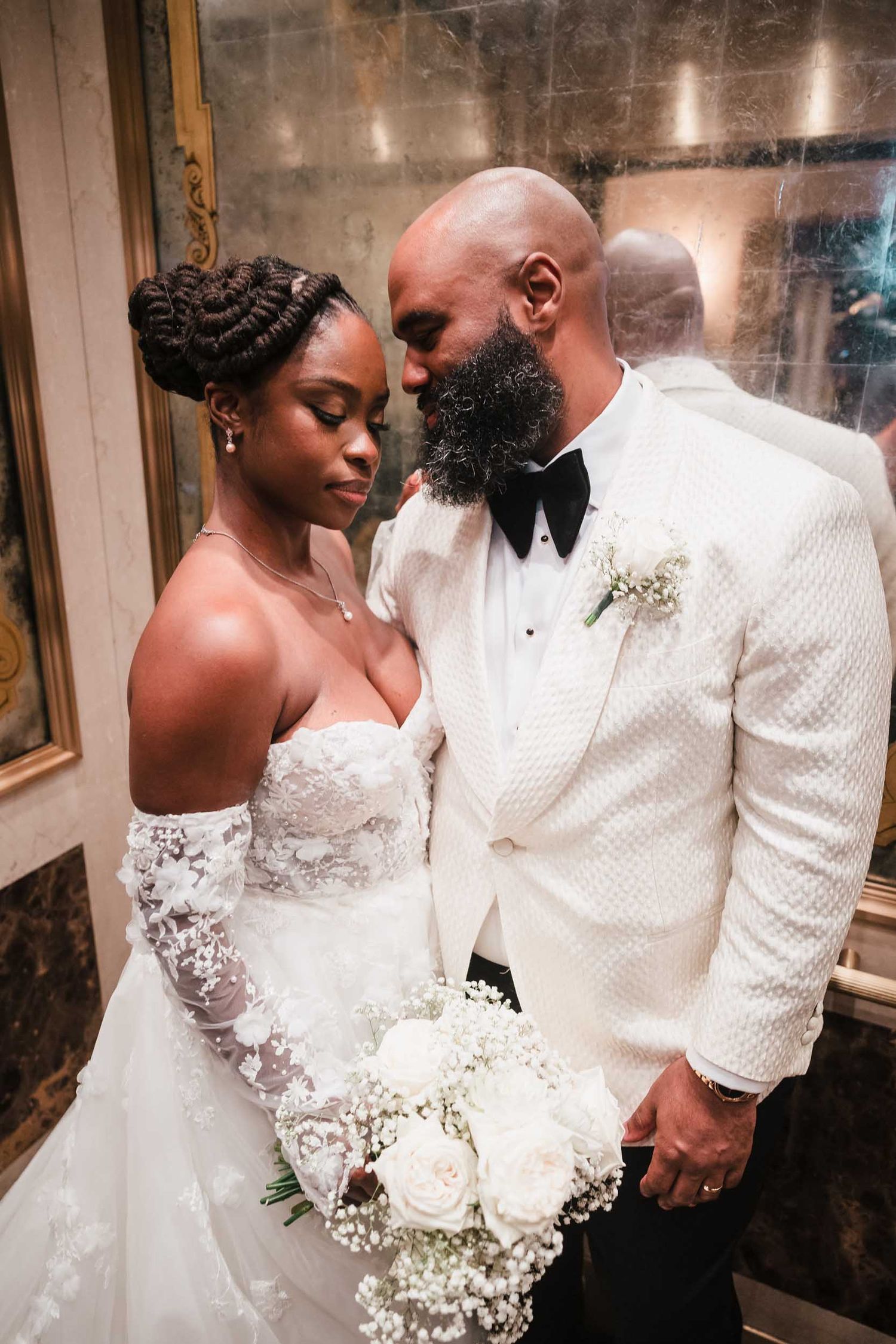 Intimate bride and groom portrait inside historic elevator at Lenox Hotel Boston with soft romantic lighting