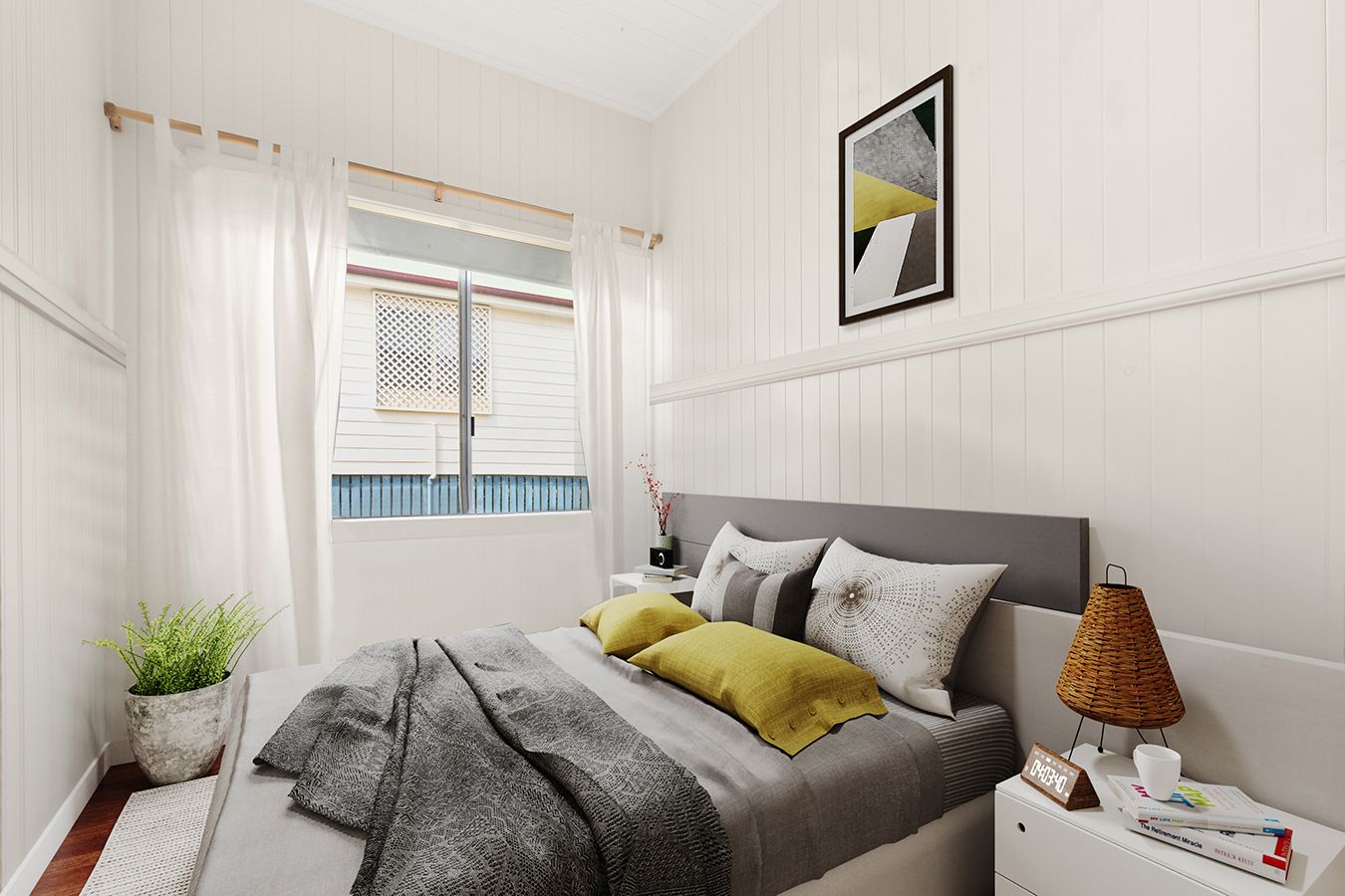 Cosy bedroom with grey upholstered bed, yellow accent pillows, white panelled walls, and natural light.