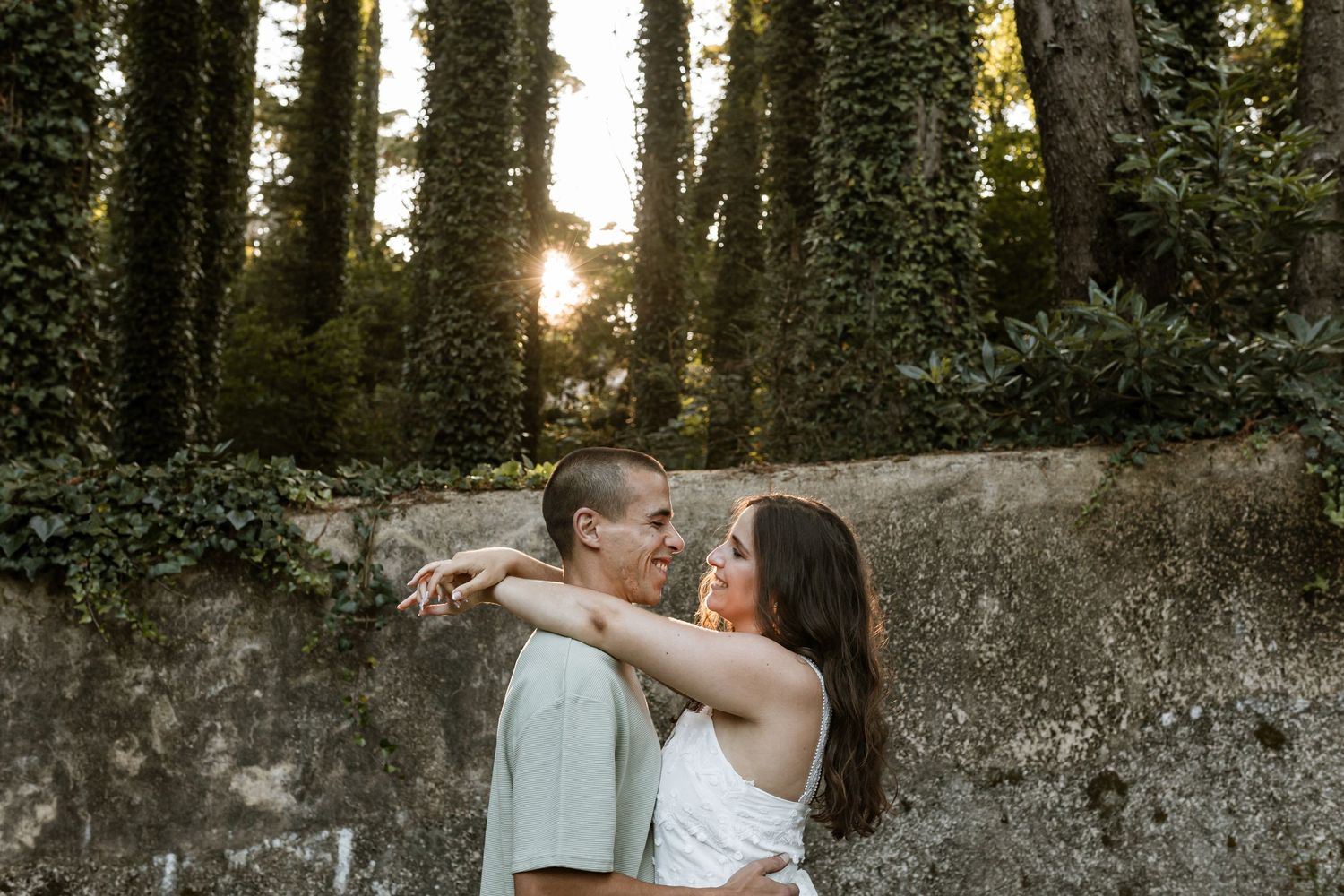 Romantic pre-wedding session in Sintra with couple hugging and smiling