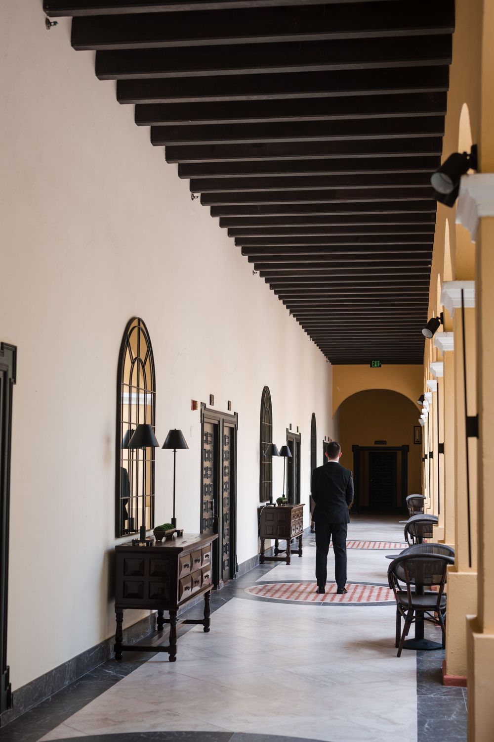 Groom portrait in colonial corridor at Hotel El Convento wedding in Puerto Rico