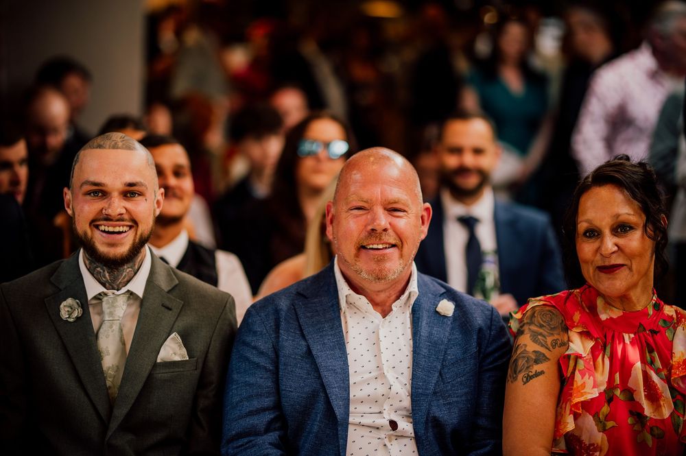 Candid photos of wedding guests smiling and laughing during a reception celebration.