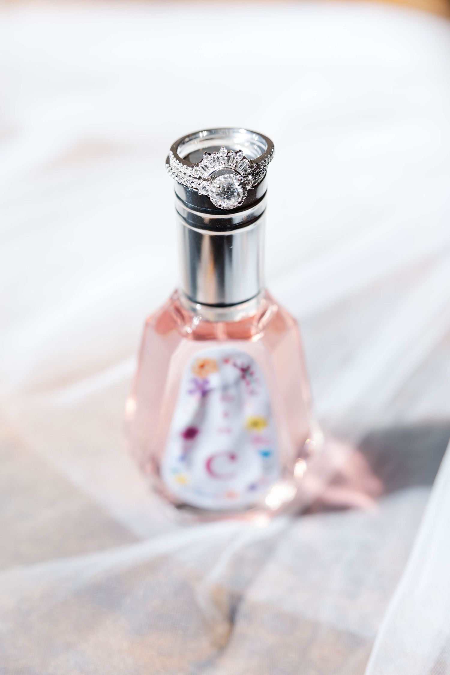 stunning wedding ring and perfume detail shot