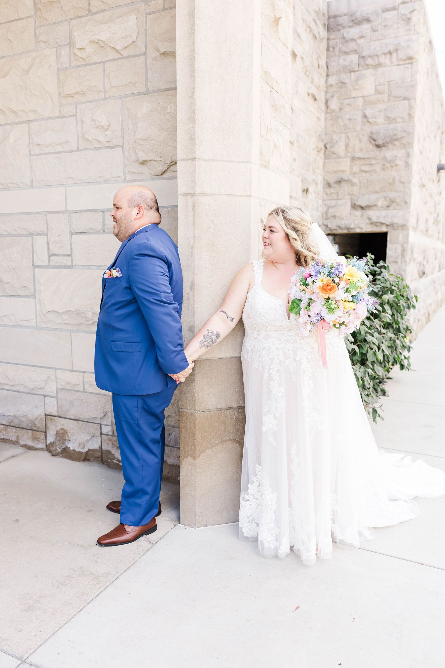 bride and groom holding hands during first look in springfield il