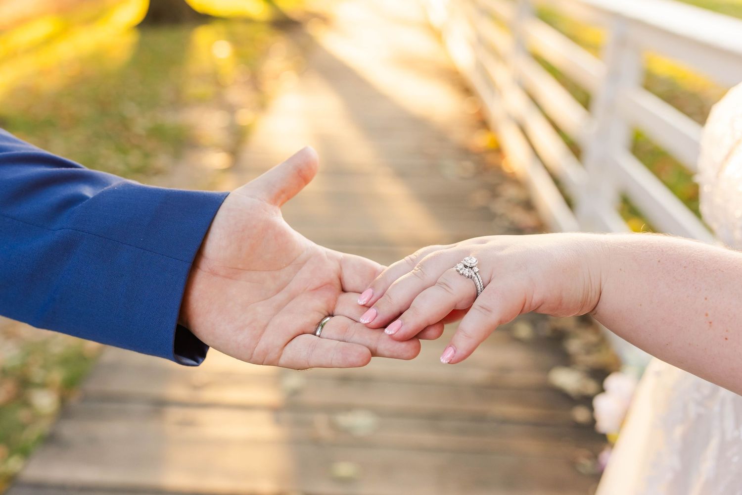 bride and groom holding hands during golden hour portraits