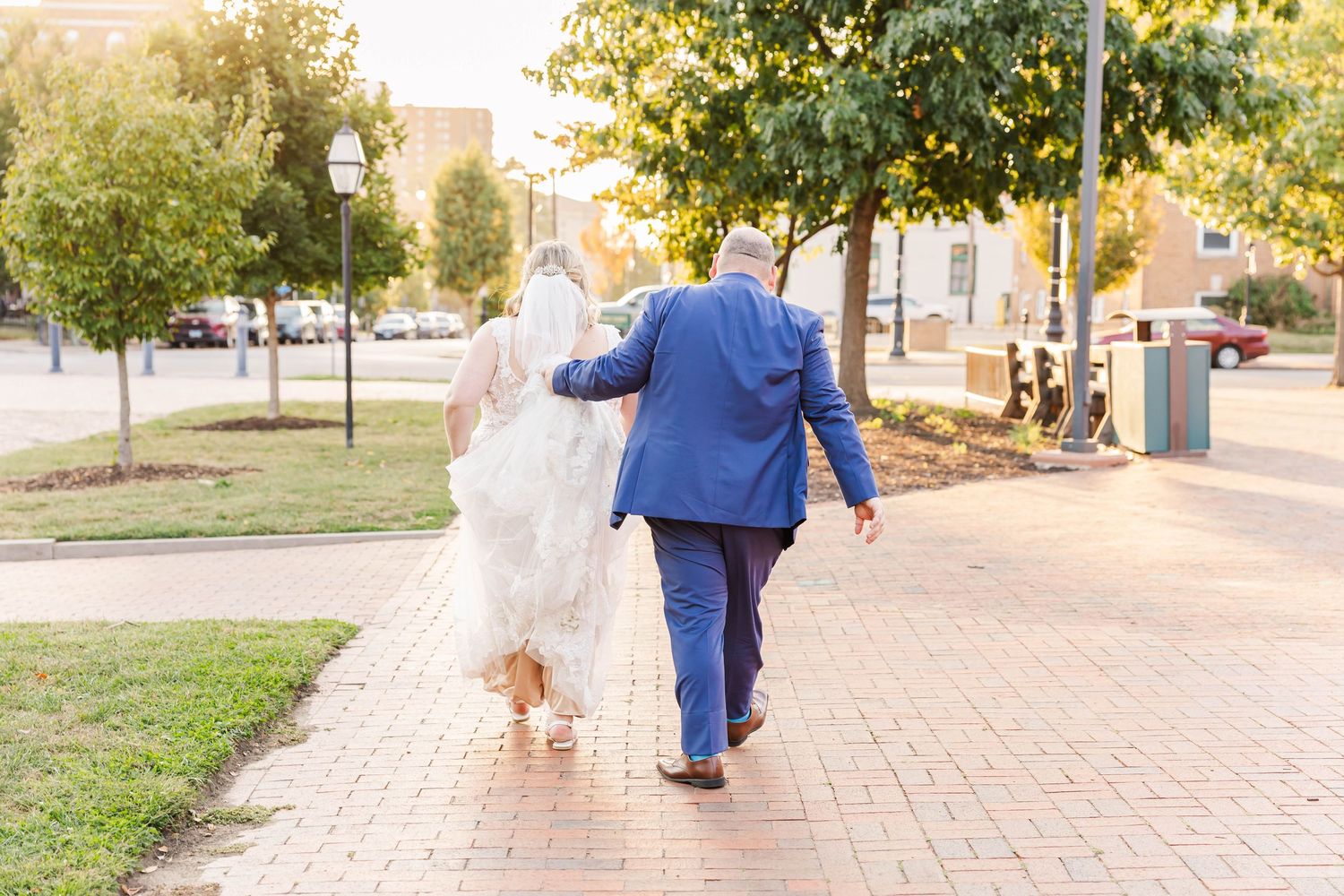 Intimate golden hour moment between bride and groom in historic downtown Springfield