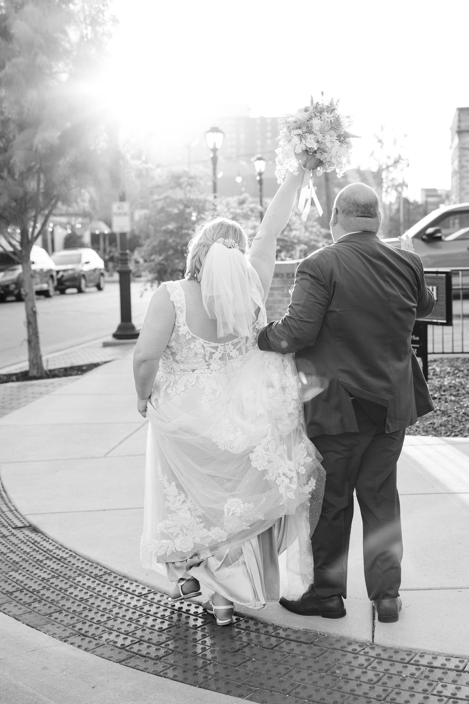 Intimate golden hour moment between bride and groom in historic downtown Springfield