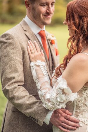 A series of romantic wedding photos showing close-up moments between a couple wearing tweed and white lace.