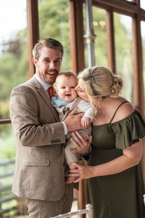 Sweet family moments captured in a series of candid photos showing tender interactions in a sunlit room.