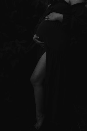 A series of black and white abstract silhouettes arranged in a row against a dark background.