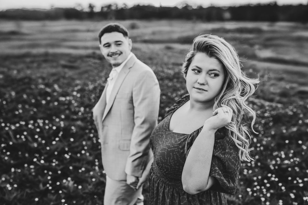 Hunter and Gavin engagement photos in Texas field at sunset.