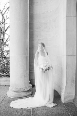 Classic bridal portraits with white columns creating an elegant architectural backdrop.
