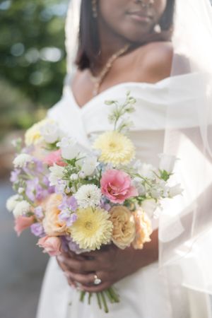 Beautiful pastel wedding bouquets with roses, gerberas and mixed flowers.